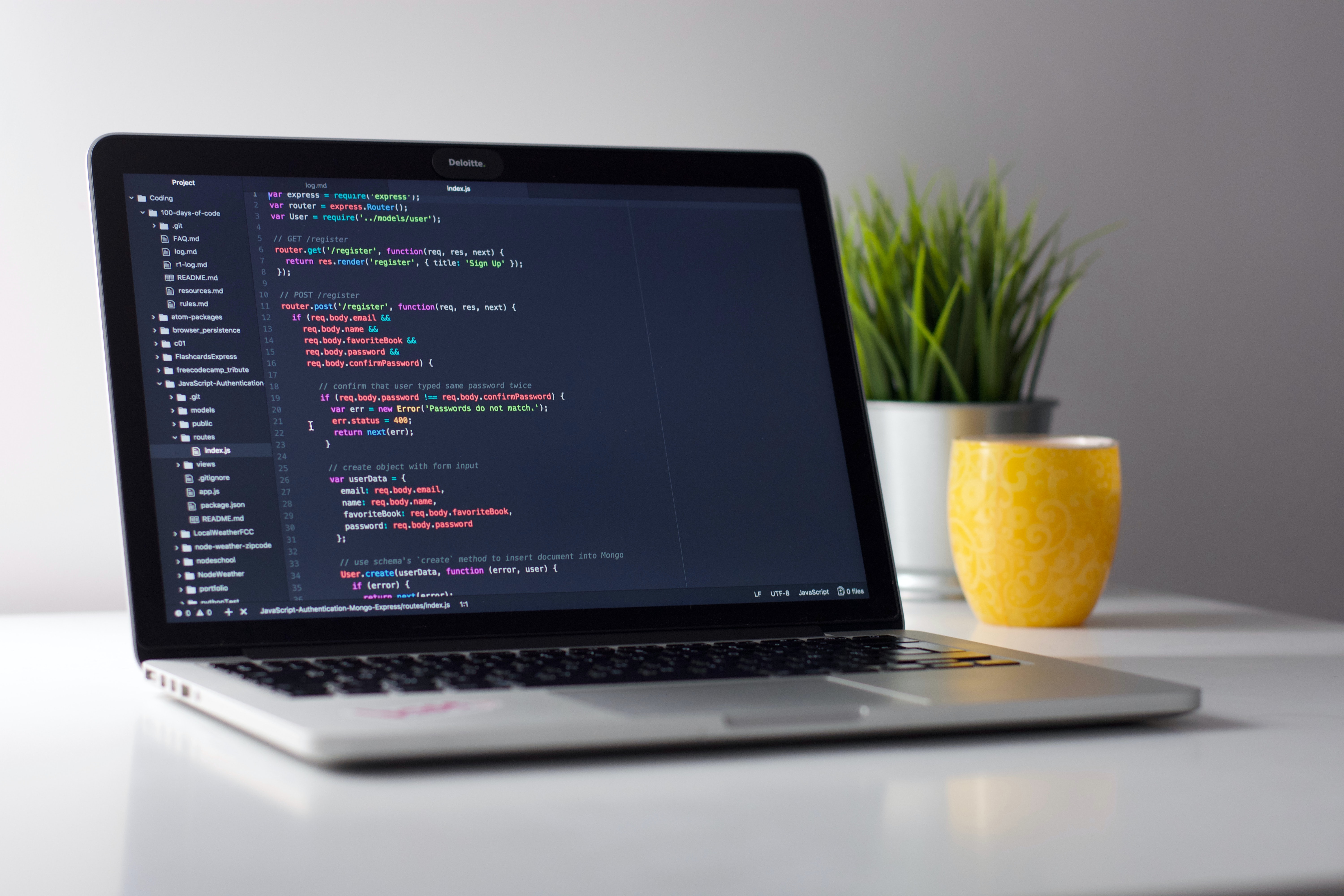 Laptop with code editor open